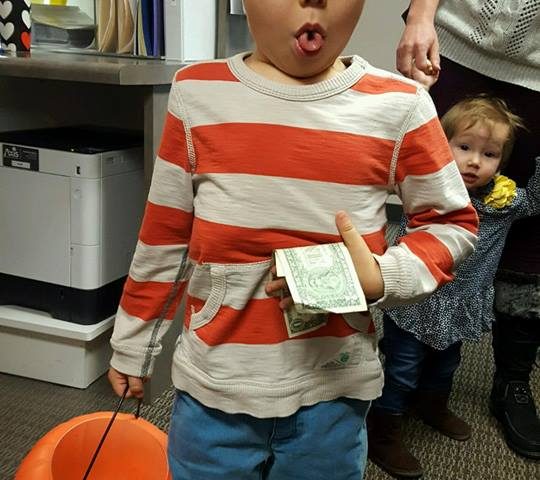 A child participating in Operation Gratitude Candy Buy Back at Lydiatt and Duru Family Dentistry.