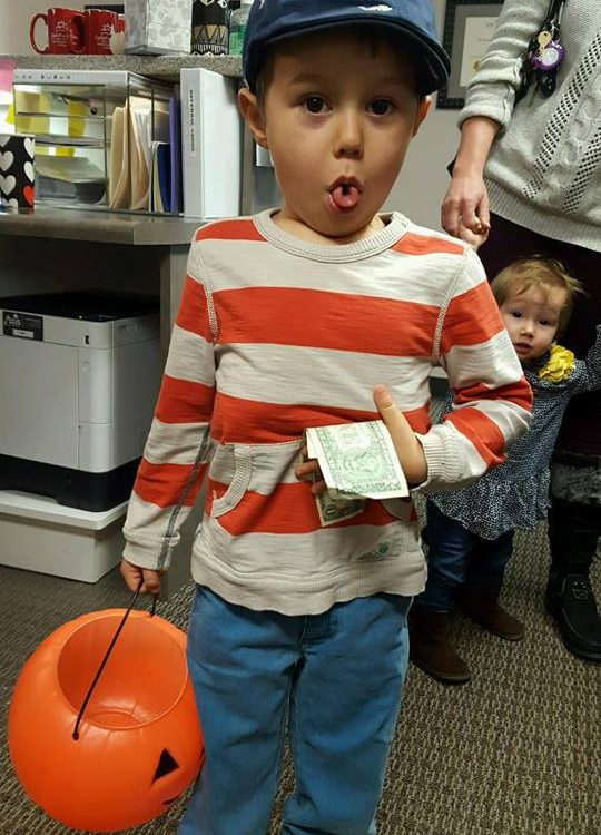 A child participating in Operation Gratitude Candy Buy Back at Lydiatt and Duru Family Dentistry.