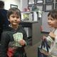 Two children participating in Operation Gratitude Candy Buy Back at Lydiatt and Duru Family Dentistry.