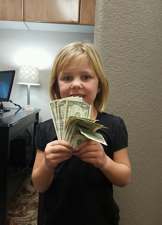 A child participating in Operation Gratitude Candy Buy Back at Lydiatt and Duru Family Dentistry.