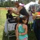 A child getting his face painted at the Colorado Springs Family Friendly Beer Festival.