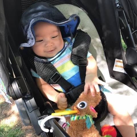 A smiling baby at the Colorado Springs Family Friendly Beer Festival.